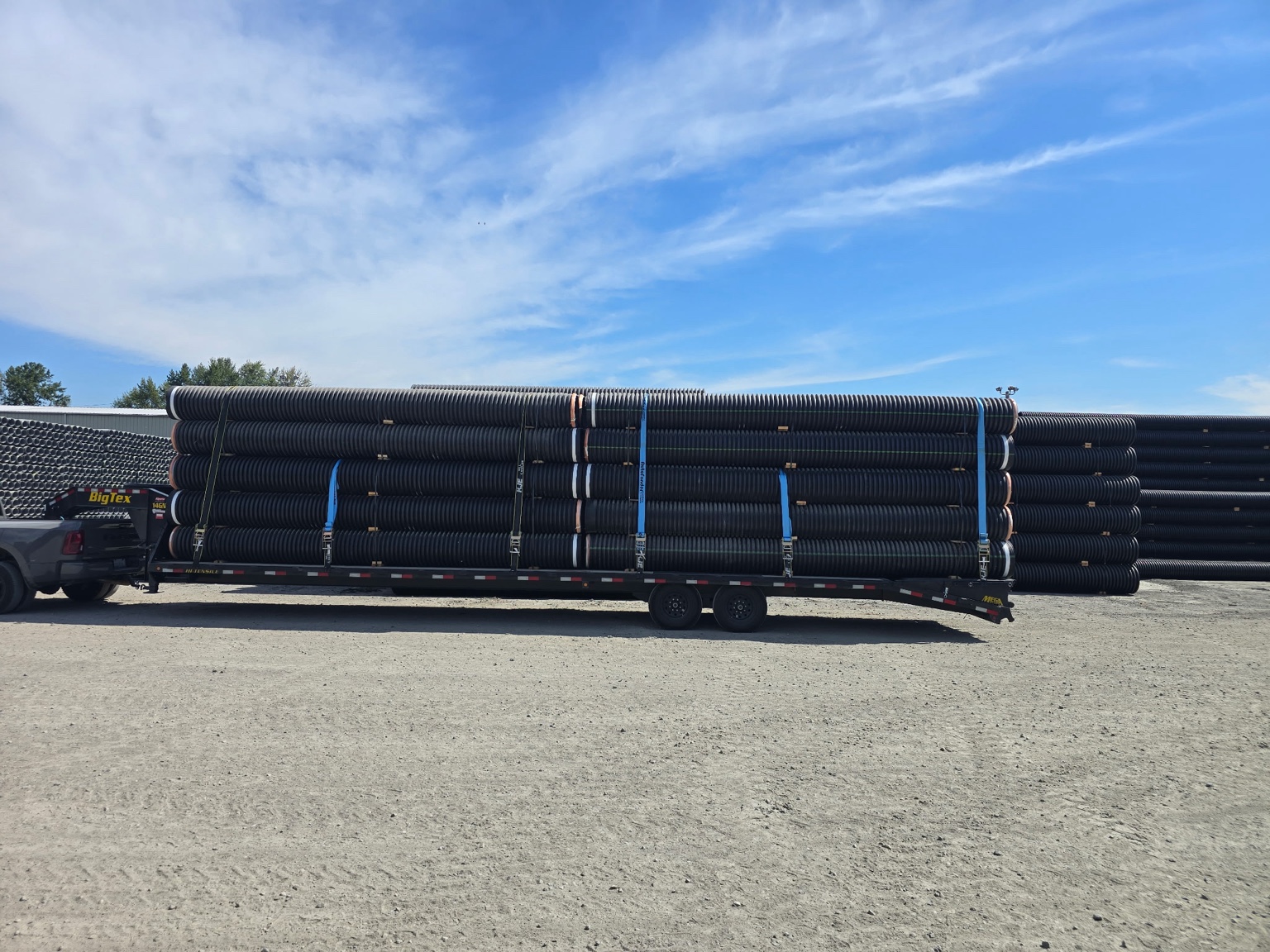 Large pipe load on gooseneck trailer