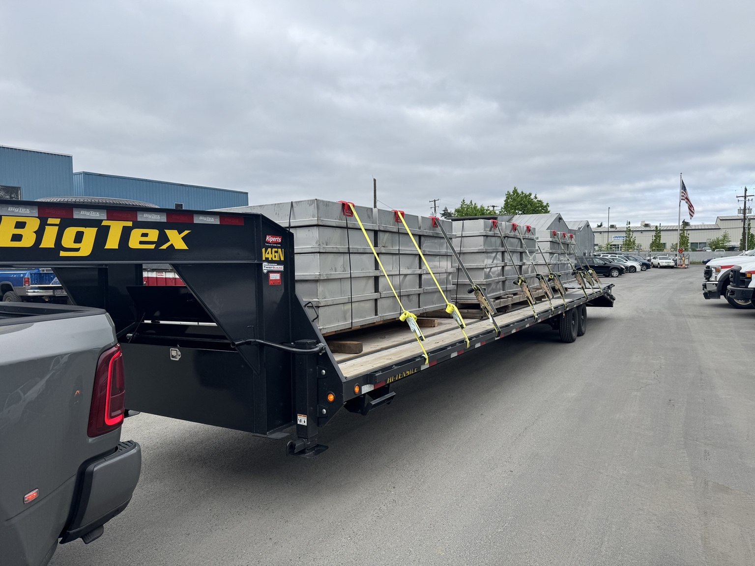 Large metal containers secured on trailer